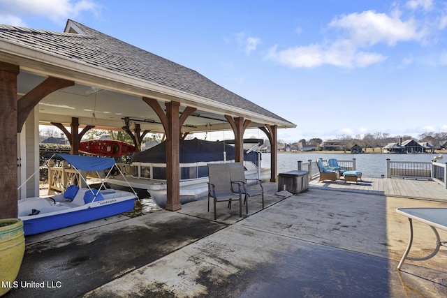 view of patio / terrace featuring a boat dock and a water view