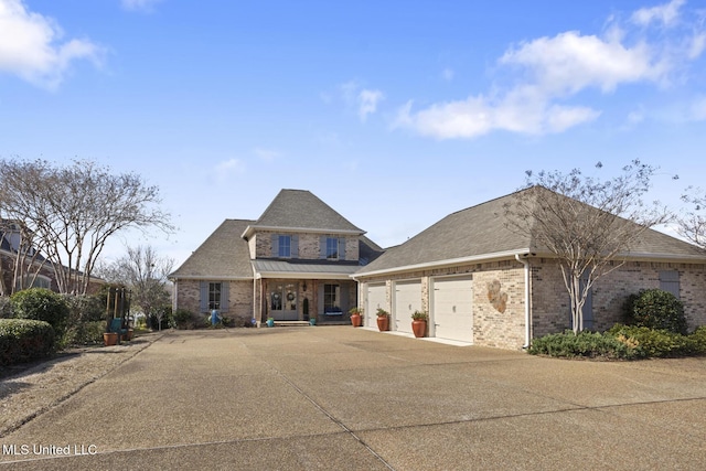 view of front facade featuring driveway, brick siding, an attached garage, and a shingled roof