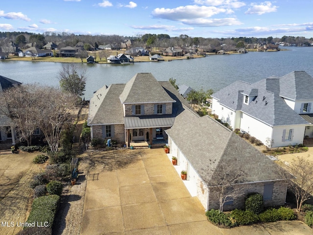 bird's eye view featuring a water view and a residential view