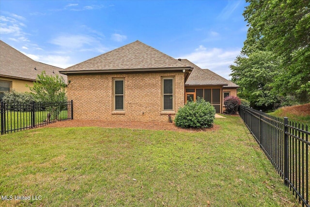 407 Belle Pointe Ln, Madison, MS 39110 - back of property featuring roof with shingles, brick siding, and a sunroom
