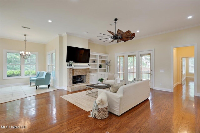 407 Belle Pointe Ln, Madison, MS 39110 - living room featuring a chandelier, plenty of natural light, ornamental molding, baseboards, and recessed lighting