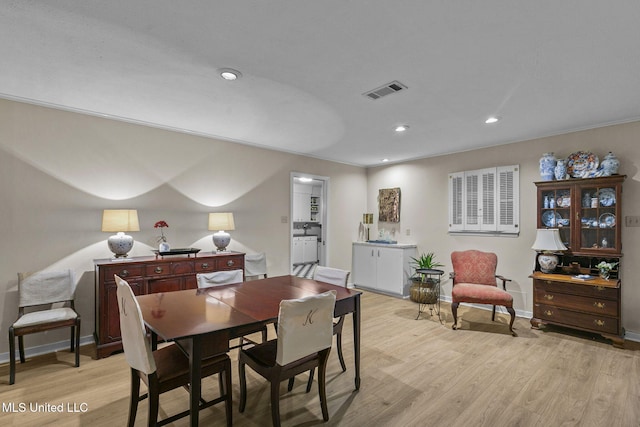 dining room with light wood-type flooring