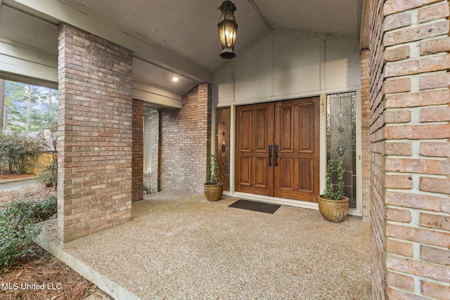 view of exterior entry featuring a porch