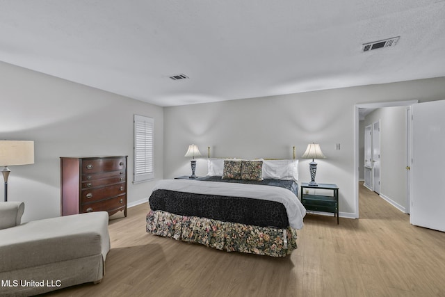 bedroom with light wood-type flooring