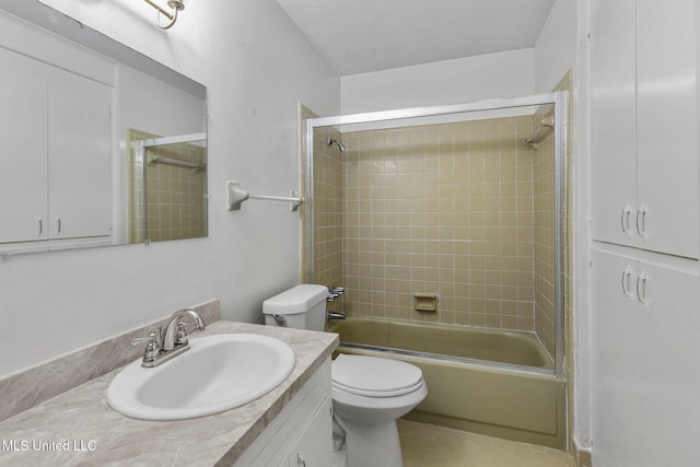 full bathroom featuring vanity, toilet, and tiled shower / bath