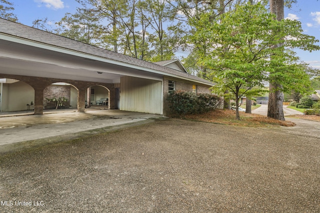 exterior space featuring a carport