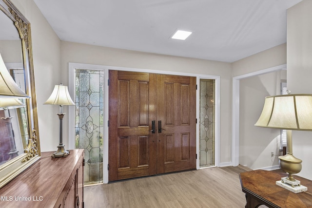 foyer entrance with light wood-type flooring