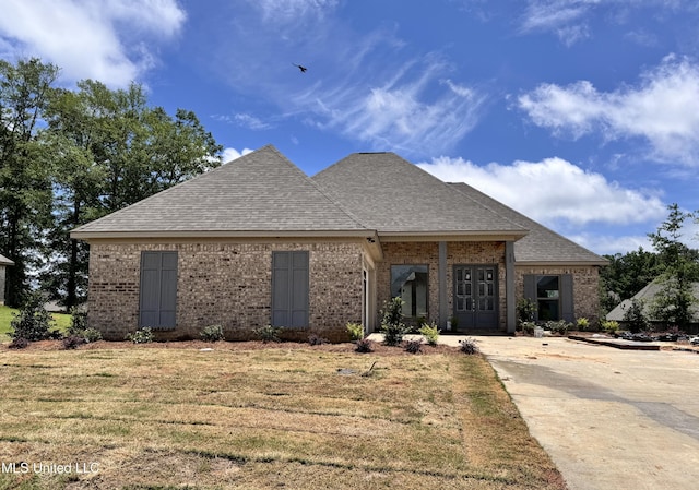 652 Prosperity Pl, Brandon, MS 39042 - view of front of home with brick siding, roof with shingles, and a front yard