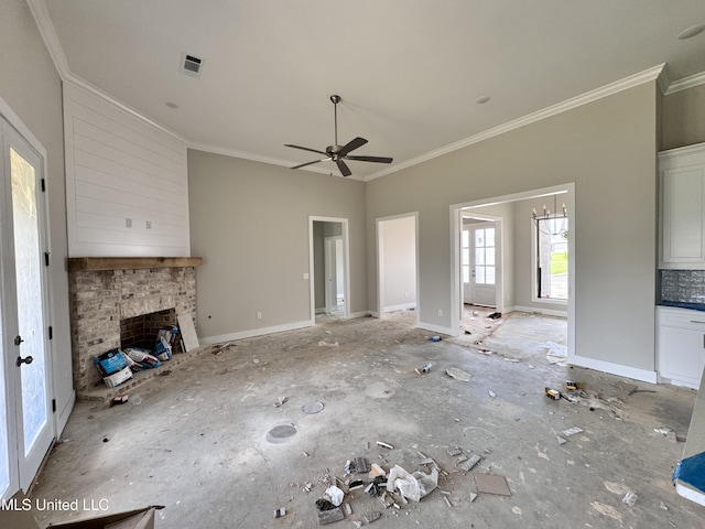 652 Prosperity Pl, Brandon, MS 39042 - unfurnished living room featuring ornamental molding, ceiling fan, and a brick fireplace