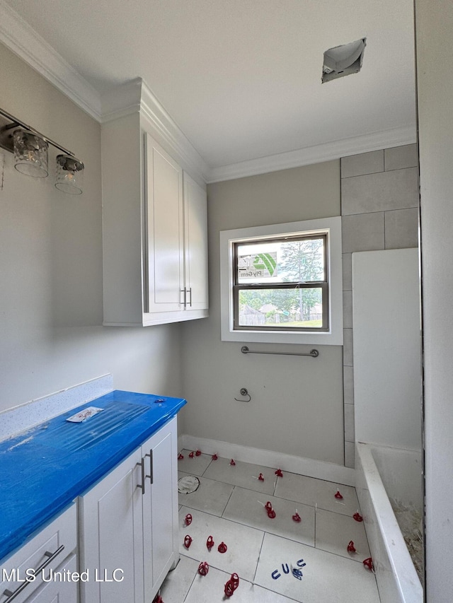 652 Prosperity Pl, Brandon, MS 39042 - bathroom featuring crown molding, a tub, and vanity