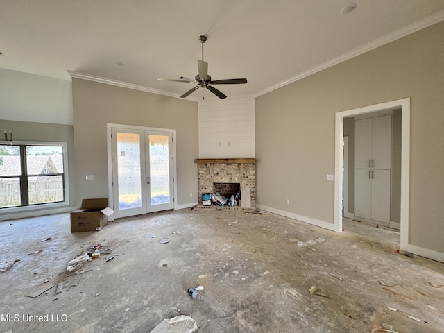 652 Prosperity Pl, Brandon, MS 39042 - unfurnished living room with ornamental molding, plenty of natural light, french doors, a fireplace, and a ceiling fan