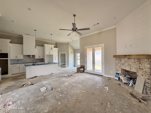 652 Prosperity Pl, Brandon, MS 39042 - unfurnished living room with ornamental molding, french doors, and a ceiling fan