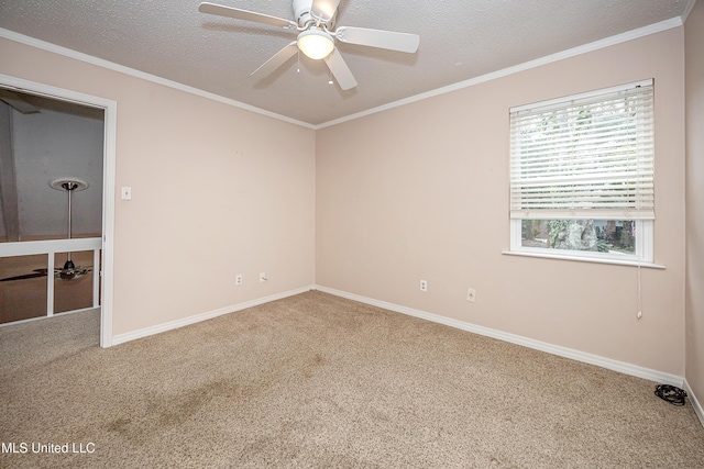 carpeted spare room with a textured ceiling, ceiling fan, and crown molding