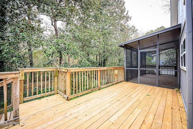 deck with a sunroom