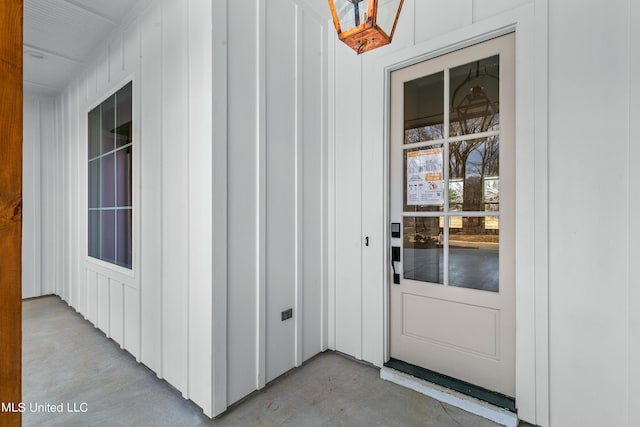 entrance to property featuring board and batten siding