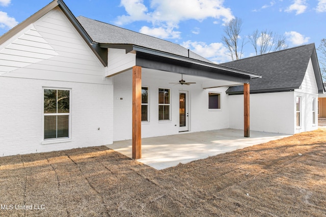 back of house featuring brick siding, a patio, a shingled roof, and a ceiling fan