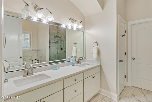 bathroom with vanity and a shower with door