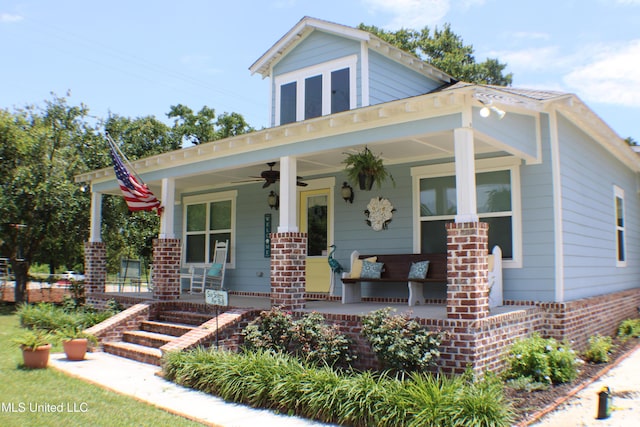 605 Magnolia St, Long Beach, MS 39560 - view of front facade featuring covered porch, brick siding, and ceiling fan