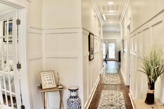 605 Magnolia St, Long Beach, MS 39560 - corridor featuring a decorative wall, dark wood-style floors, crown molding, attic access, and a wainscoted wall