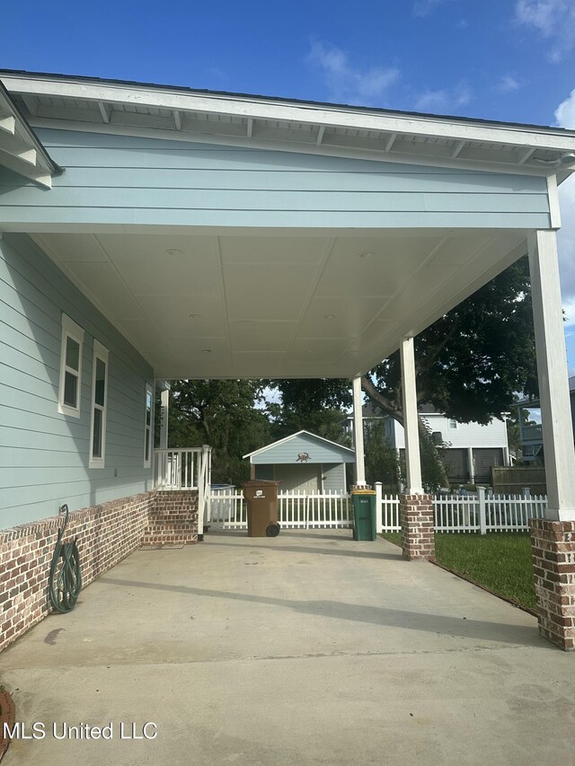 605 Magnolia St, Long Beach, MS 39560 - view of patio / terrace with a carport