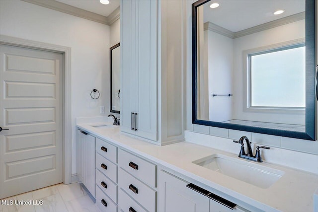 bathroom with vanity and ornamental molding