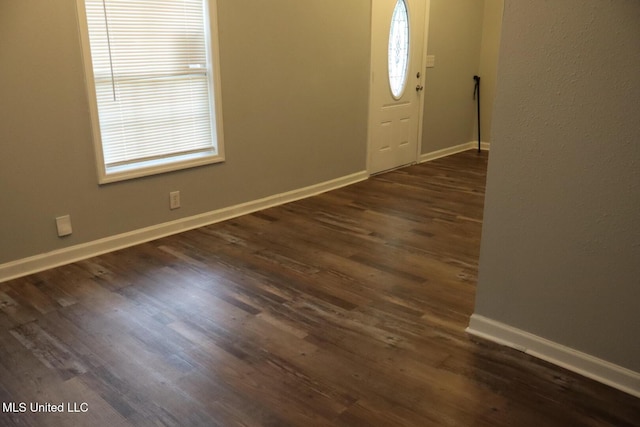 2411 14th St, Pascagoula, MS 39567 - entrance foyer with baseboards and dark wood-style floors