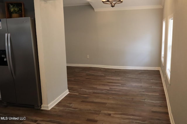2411 14th St, Pascagoula, MS 39567 - unfurnished dining area with ornamental molding, baseboards, dark wood finished floors, and a chandelier