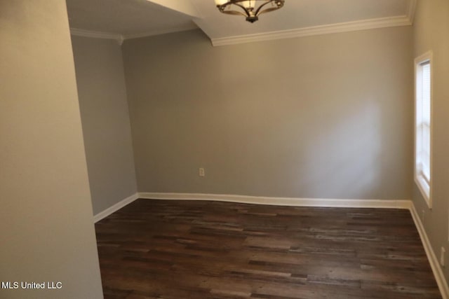 2411 14th St, Pascagoula, MS 39567 - spare room with ornamental molding, dark wood-style flooring, a chandelier, and baseboards