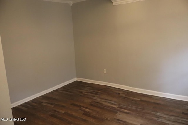 2411 14th St, Pascagoula, MS 39567 - spare room with ornamental molding, dark wood-type flooring, and baseboards