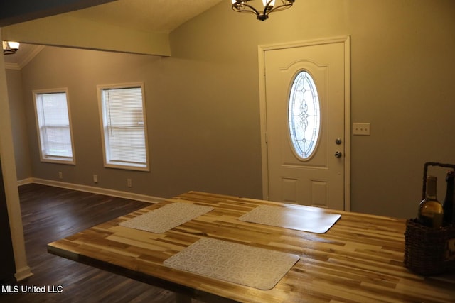 2411 14th St, Pascagoula, MS 39567 - entrance foyer with lofted ceiling, wood finished floors, a chandelier, and baseboards