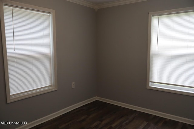 2411 14th St, Pascagoula, MS 39567 - empty room featuring ornamental molding, dark wood finished floors, and baseboards