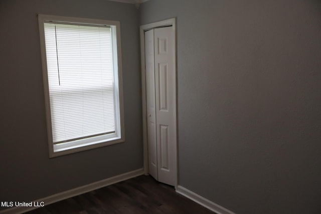 2411 14th St, Pascagoula, MS 39567 - empty room with dark wood finished floors and baseboards