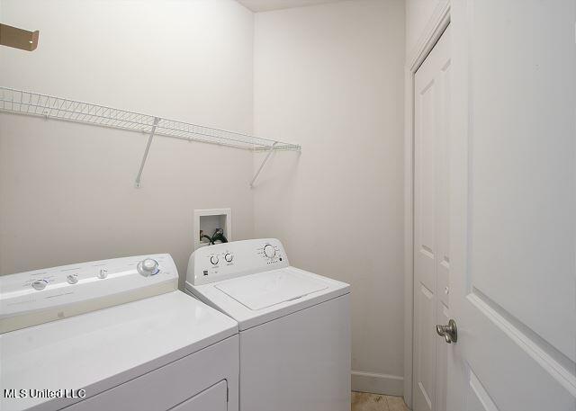 washroom featuring washer and dryer