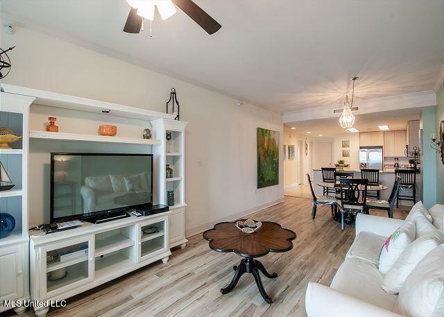 living room featuring light hardwood / wood-style flooring and ceiling fan