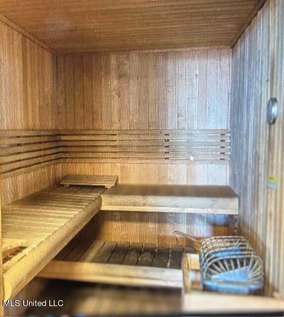 view of sauna / steam room with wooden walls