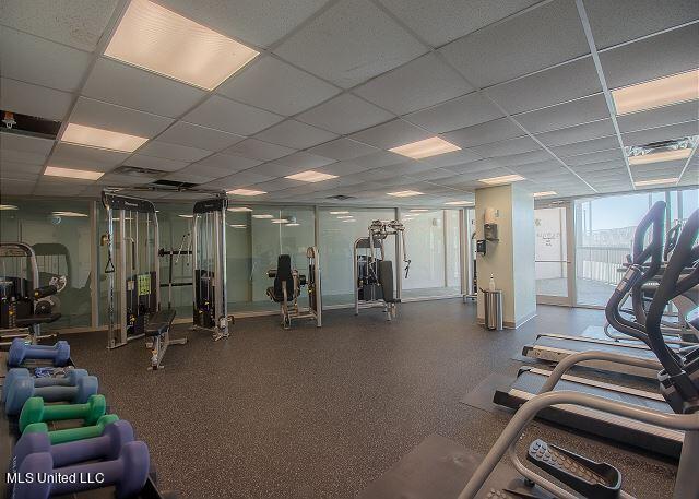 workout area with a drop ceiling