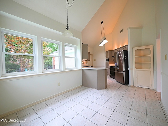 7869 Hilo Way, Diamondhead, MS 39525 - kitchen with appliances with stainless steel finishes, a sink, a peninsula, light countertops, and light tile patterned flooring