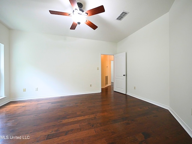 7869 Hilo Way, Diamondhead, MS 39525 - spare room featuring ceiling fan, dark wood-style flooring, and baseboards