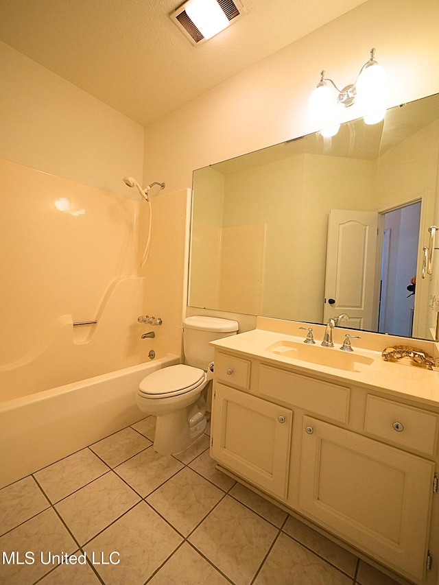 7869 Hilo Way, Diamondhead, MS 39525 - full bathroom featuring tile patterned floors, vanity, toilet, and washtub / shower combination
