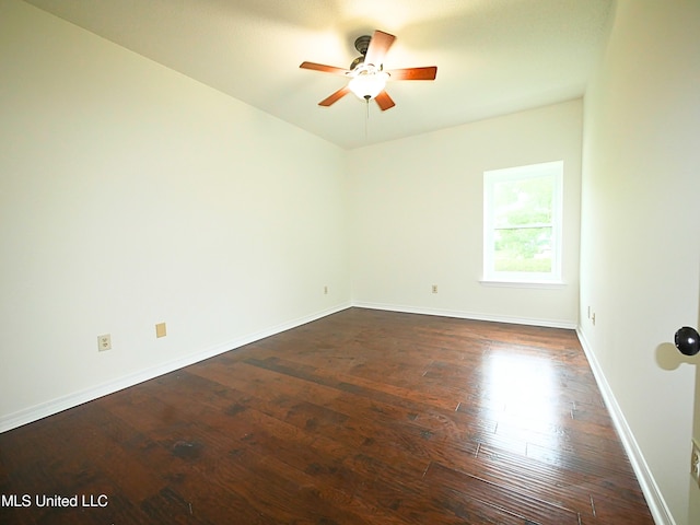 7869 Hilo Way, Diamondhead, MS 39525 - spare room featuring a ceiling fan, dark wood-style flooring, and baseboards
