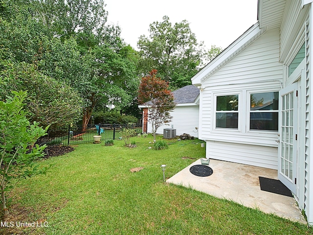 7869 Hilo Way, Diamondhead, MS 39525 - view of yard featuring central AC and a patio