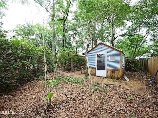 7869 Hilo Way, Diamondhead, MS 39525 - view of shed featuring fence