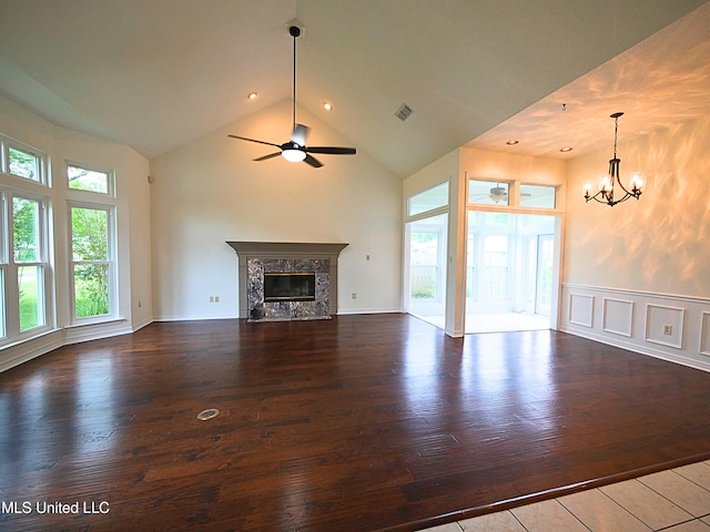 7869 Hilo Way, Diamondhead, MS 39525 - unfurnished living room featuring high vaulted ceiling, a chandelier, wood-type flooring, a ceiling fan, and a high end fireplace