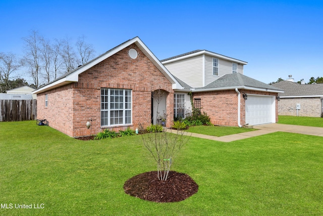 view of front of property featuring a front yard and a garage