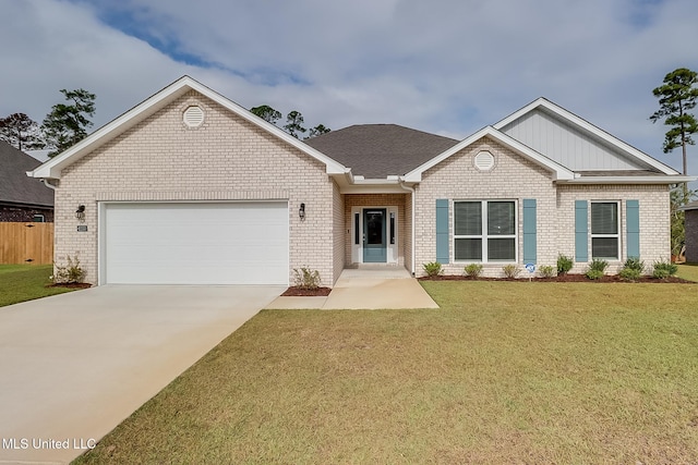 view of front of house featuring a garage and a front lawn