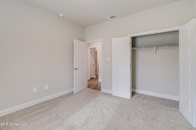 6253 Sandhill Cv, Ocean Springs, MS 39564 - unfurnished bedroom featuring carpet floors, baseboards, and a closet