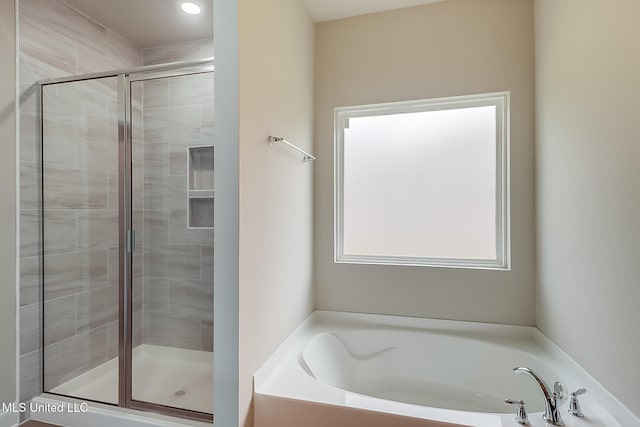 bathroom featuring plus walk in shower