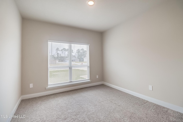 unfurnished room featuring carpet flooring