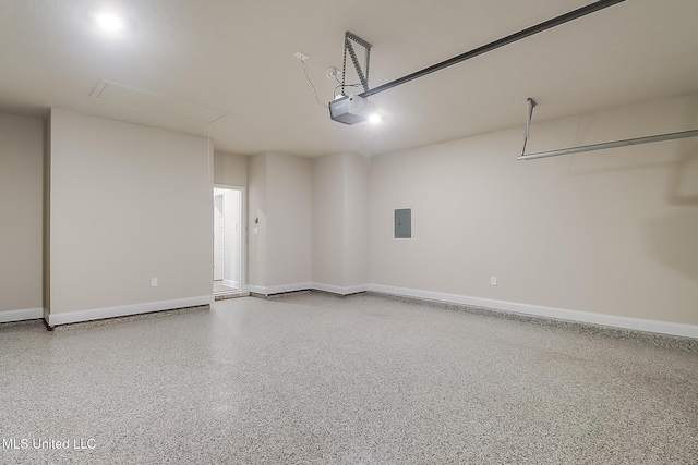 garage featuring a garage door opener and electric panel