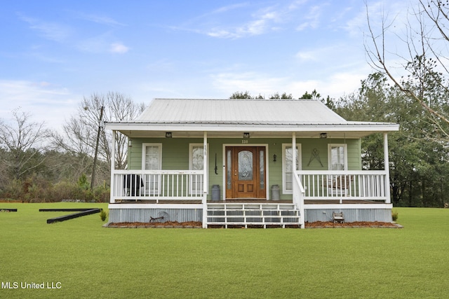 view of front of house featuring covered porch, metal roof, and a front lawn